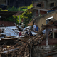 Residents and volunteers look for victims after mudslides in Petrópolis, Brazil.